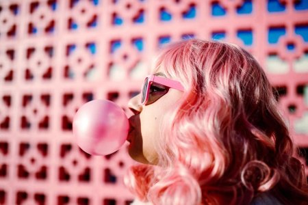Blowing bubble gum