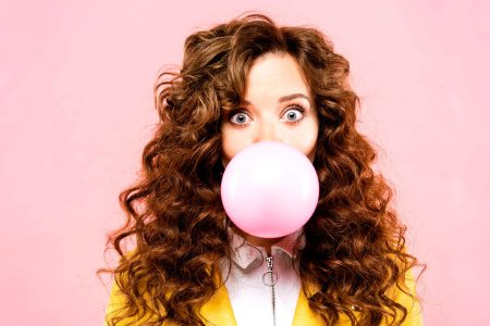 Blowing bubble gum