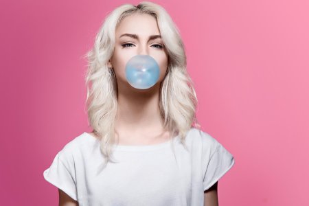 Blowing bubble gum